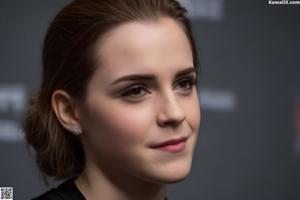 A close up of a woman's face with a black background.